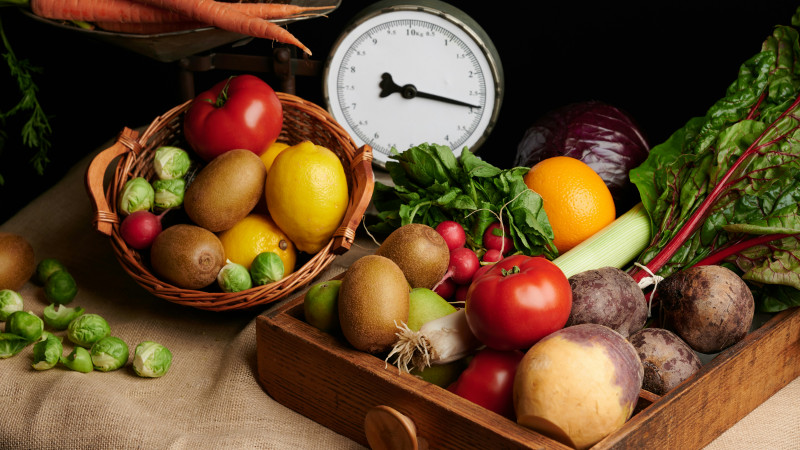 a wooden box filled with lots of different types of vegetables